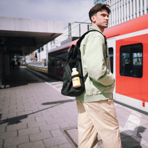 Yfood Lifestyle, Man on the go catching a train, Yfood in his bag