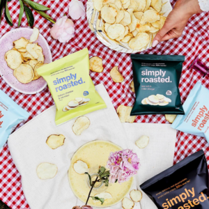 A picnic blanket with various simply roasted crisps on it