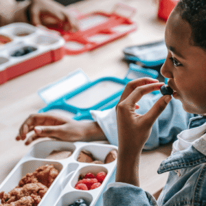 Boy eating a packed lunch